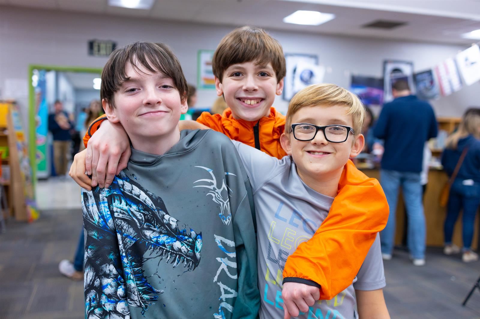 Three boys in the book fair.